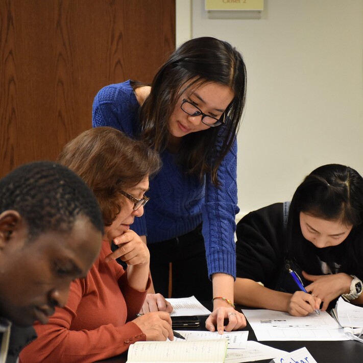 grad students working in a classroom